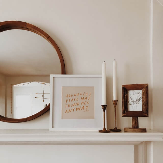 white candle and mirror on background
